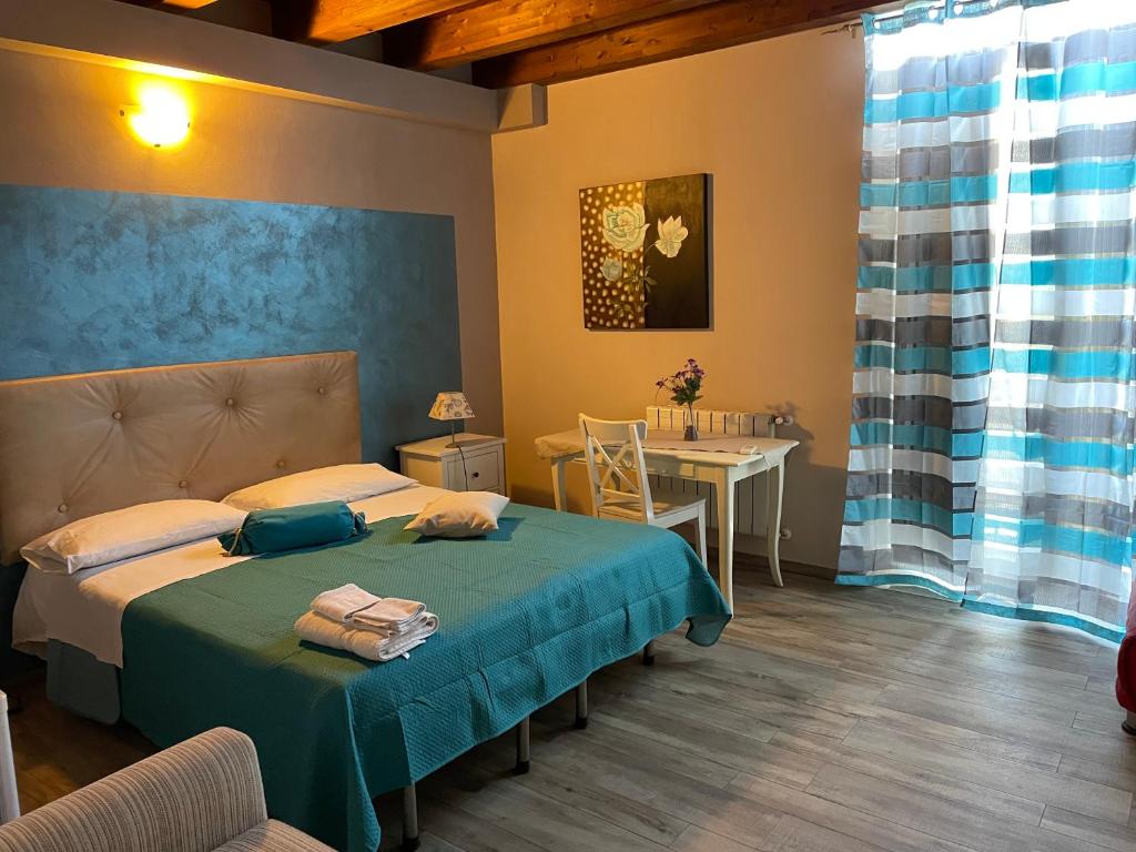 Postel nebo postele na pokoji v ubytování B&b Asterios