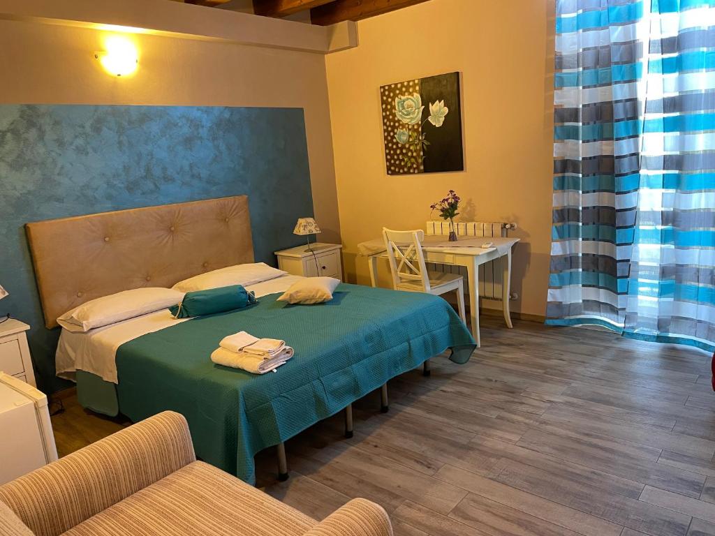 Postel nebo postele na pokoji v ubytování B&b Asterios