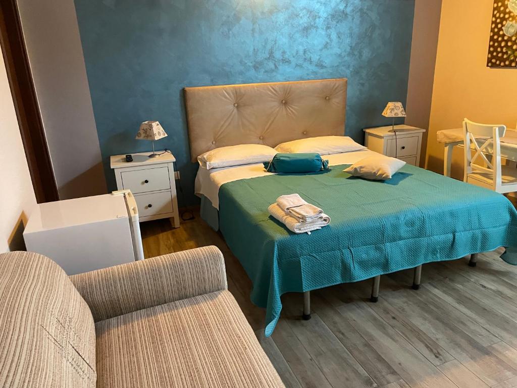 Postel nebo postele na pokoji v ubytování B&b Asterios