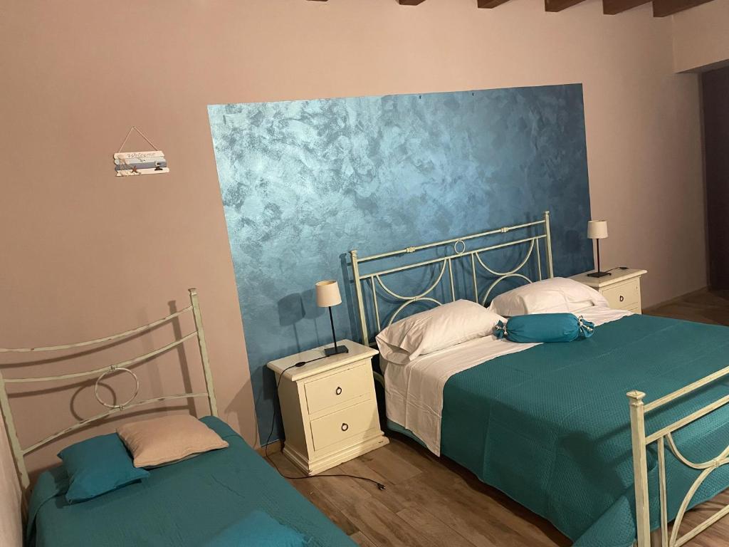 Postel nebo postele na pokoji v ubytování B&b Asterios