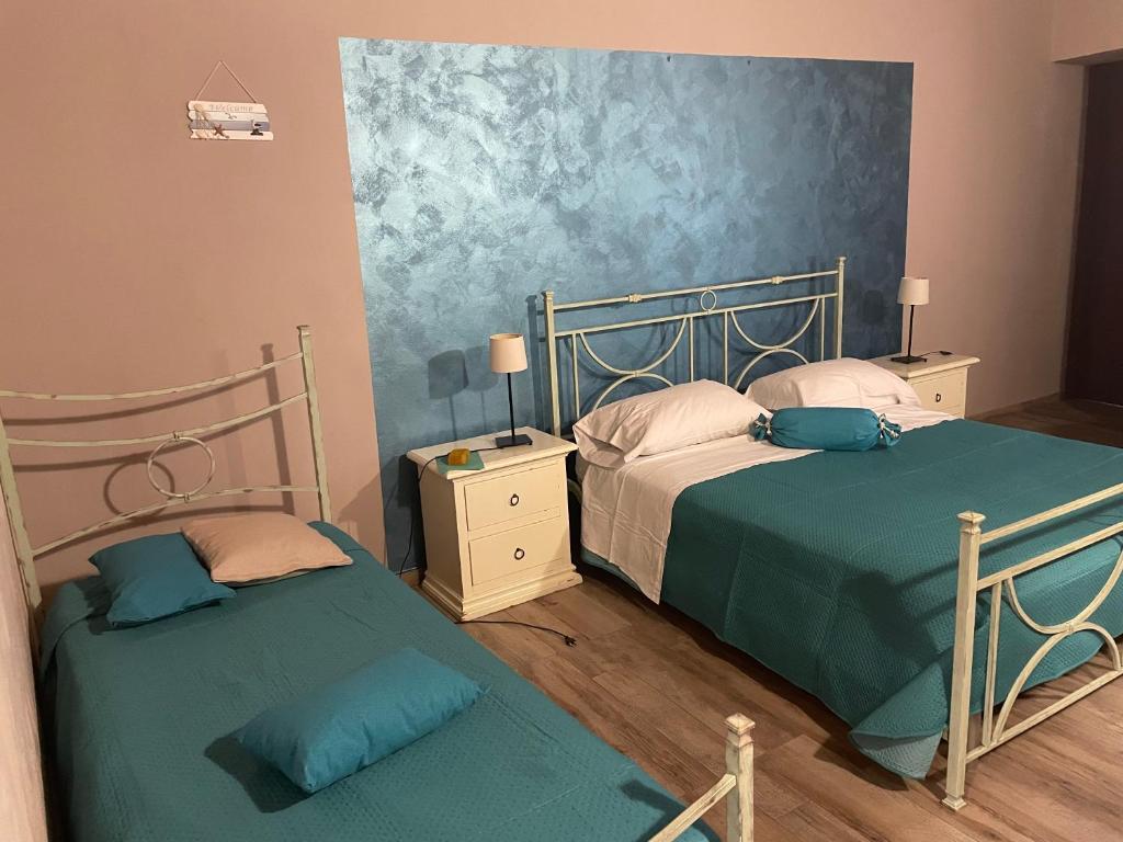 Postel nebo postele na pokoji v ubytování B&b Asterios