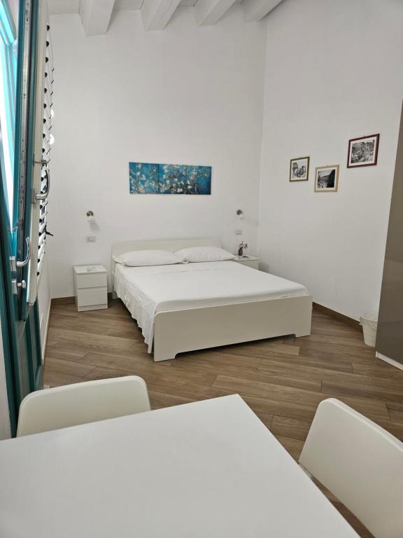 Postel nebo postele na pokoji v ubytování B&B Mormina