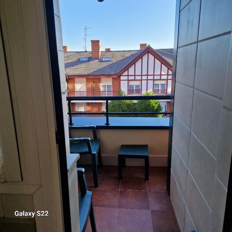a balcony with a view of a house at Castro Urdiales in Castro-Urdiales