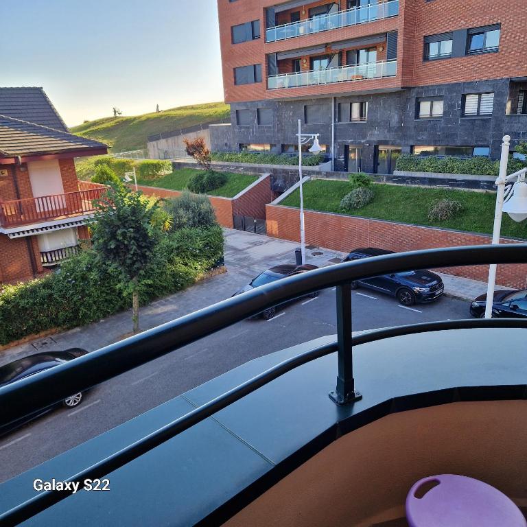 a balcony with a view of a parking lot at Castro Urdiales in Castro-Urdiales