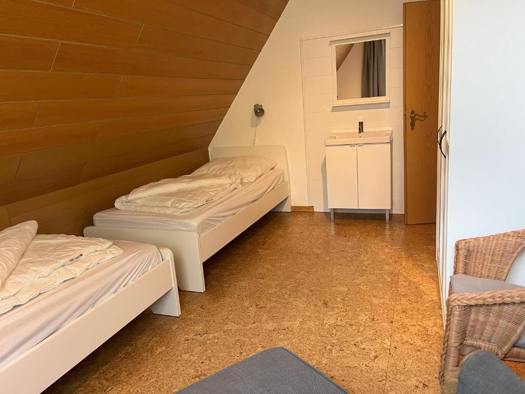 Postel nebo postele na pokoji v ubytování Küstenbude Deichbude