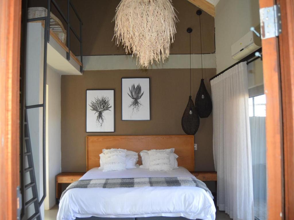 Postel nebo postele na pokoji v ubytování Stroomrivier Lodge