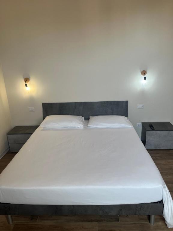 Postel nebo postele na pokoji v ubytování Casa nel borgo di Capraia