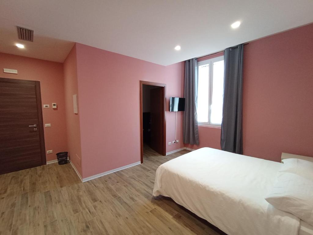 Postel nebo postele na pokoji v ubytování Casa nel borgo di Capraia