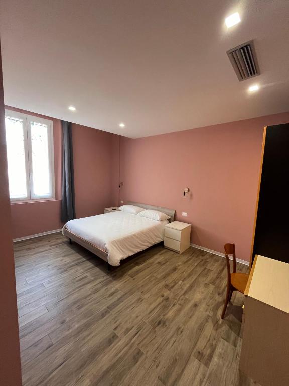 Postel nebo postele na pokoji v ubytování Casa nel borgo di Capraia