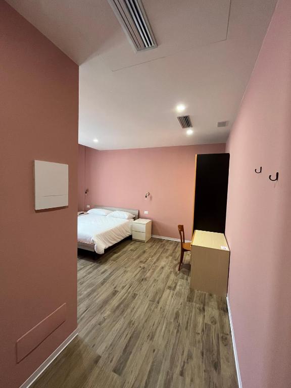 Postel nebo postele na pokoji v ubytování Casa nel borgo di Capraia