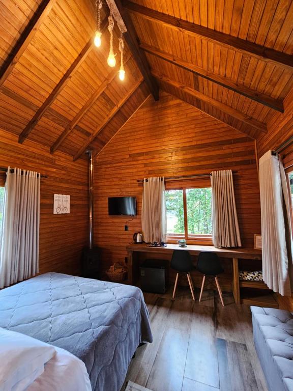 Postel nebo postele na pokoji v ubytování Pousada Árvore Da Coruja