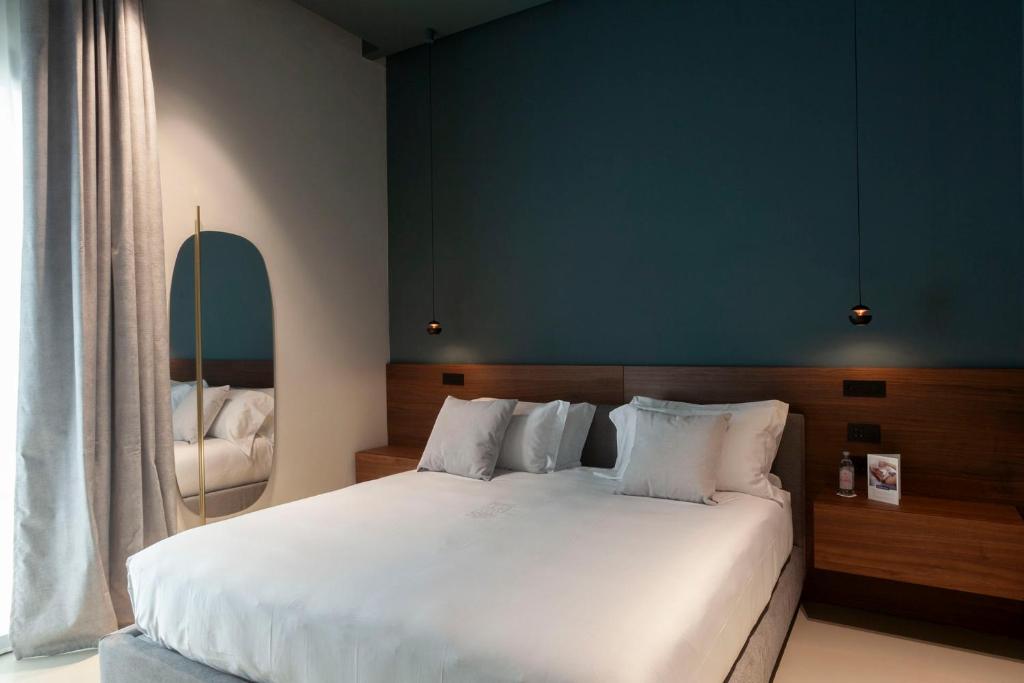 Postel nebo postele na pokoji v ubytování Palazzo Giusti Lecce - Exclusive Boutique hotel