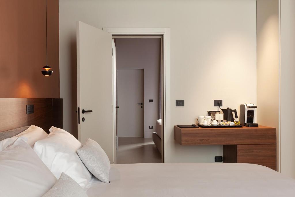 Postel nebo postele na pokoji v ubytování Palazzo Giusti Lecce - Exclusive Boutique hotel