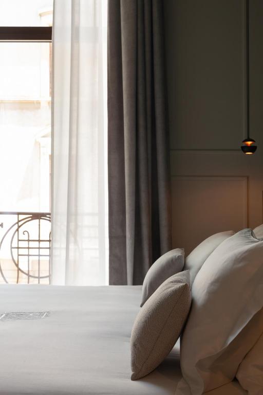 Postel nebo postele na pokoji v ubytování Palazzo Giusti Lecce - Exclusive Boutique hotel