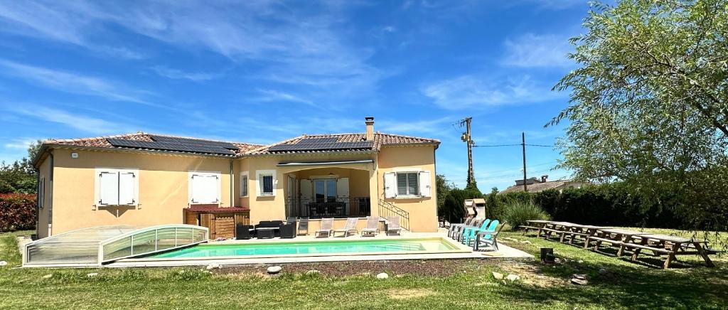 a house with a swimming pool in the yard at Liberty sur Moment-Ardèche-com in Lablachère