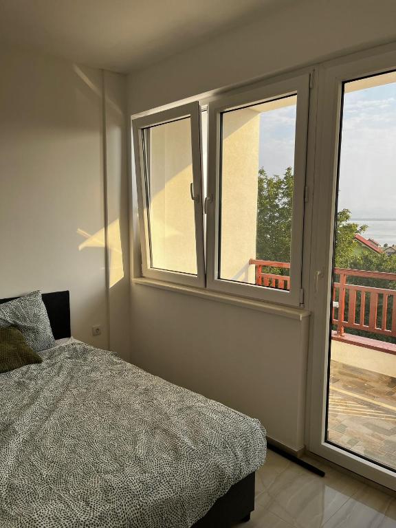 Postel nebo postele na pokoji v ubytování Radojkovic LUX