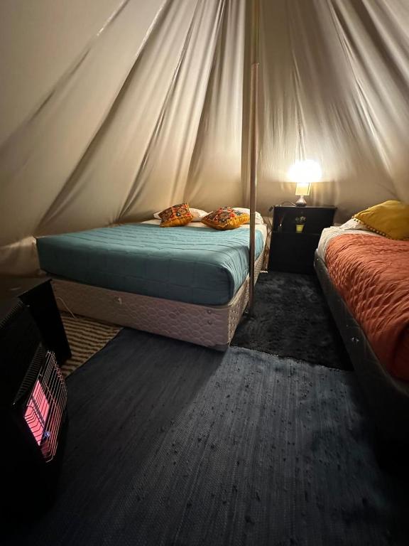 Postel nebo postele na pokoji v ubytování CaminAndes Hostal