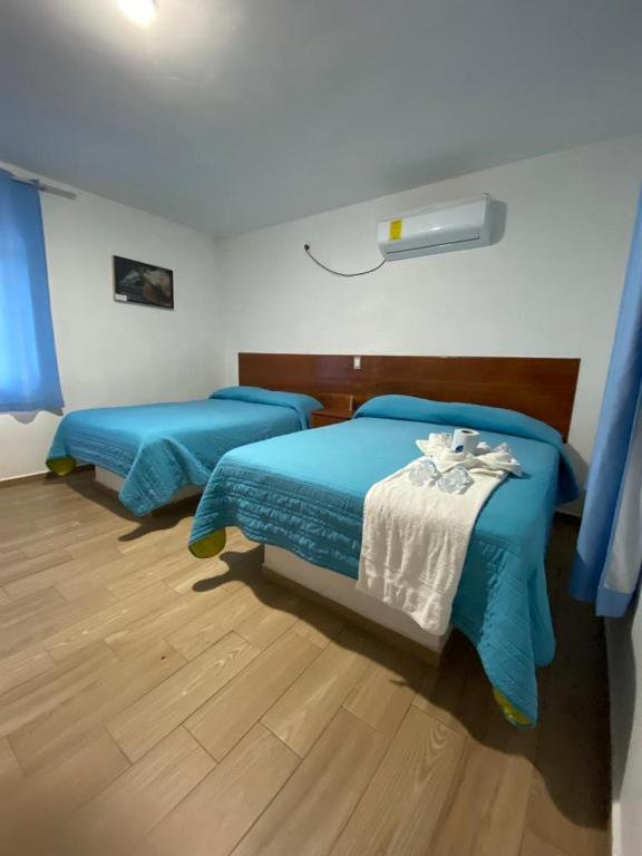 Postel nebo postele na pokoji v ubytování Hotel El Rincon de Don Juan