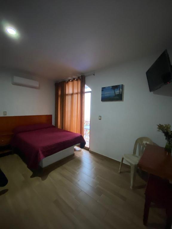 Postel nebo postele na pokoji v ubytování Hotel El Rincon de Don Juan