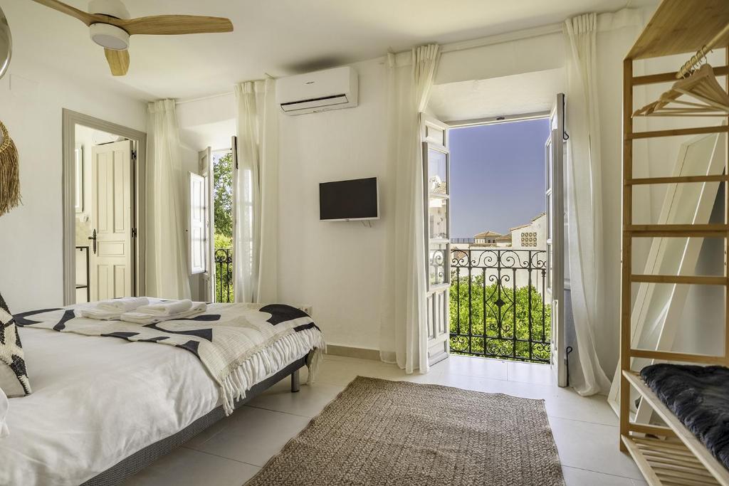 Postel nebo postele na pokoji v ubytování Casa Jardin Competa