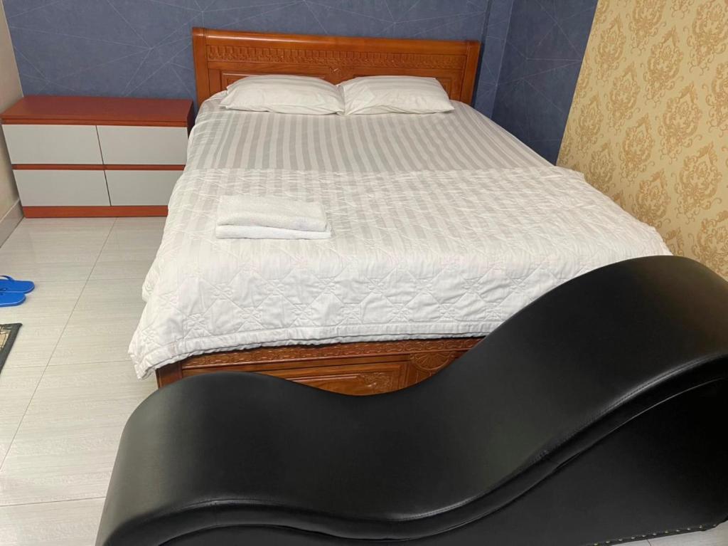 Postel nebo postele na pokoji v ubytování Minh Thư Hotel
