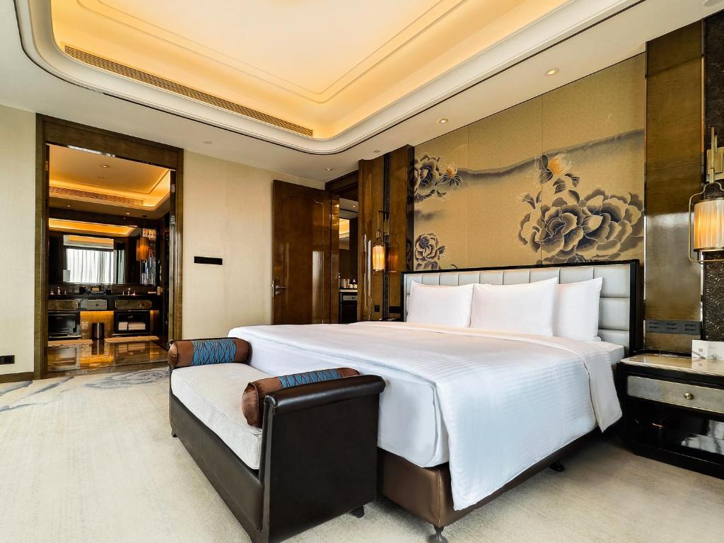 Postel nebo postele na pokoji v ubytování Wanda Vista Kunming