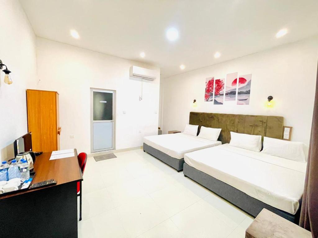 Postel nebo postele na pokoji v ubytování Ismattha Hotel