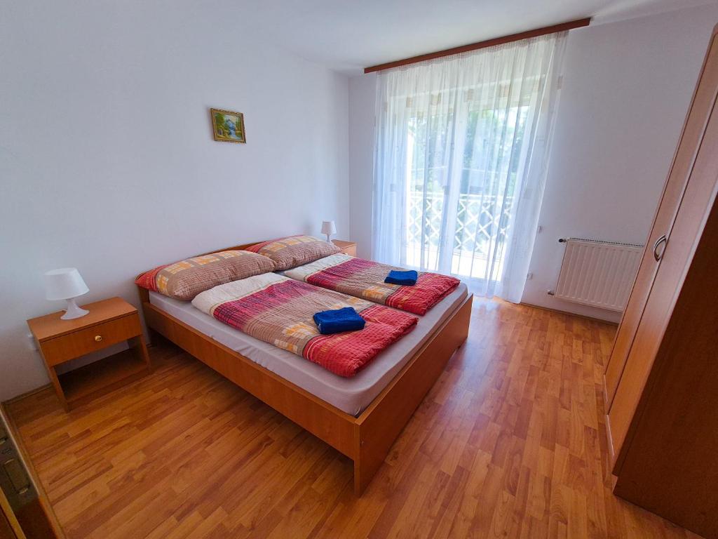 Posteľ alebo postele v izbe v ubytovaní Ildiko Apartmanhaz