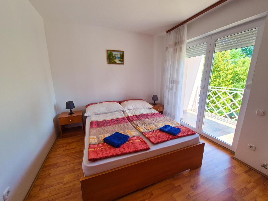Posteľ alebo postele v izbe v ubytovaní Ildiko Apartmanhaz