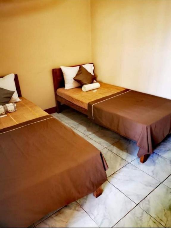 Postel nebo postele na pokoji v ubytování JBR Tourist Inn II - Port Barton