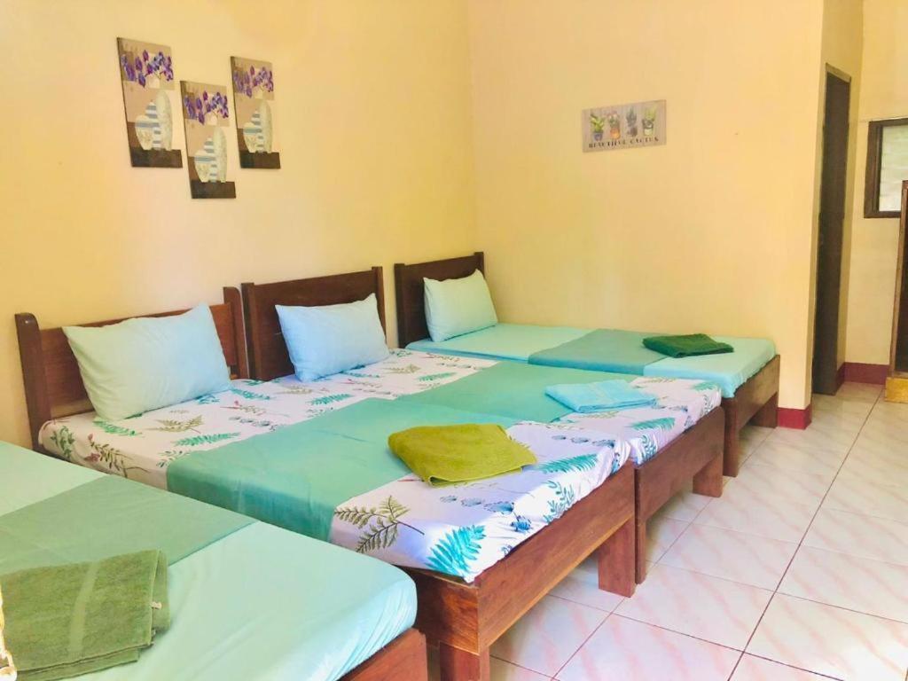 Postel nebo postele na pokoji v ubytování JBR Tourist Inn II - Port Barton