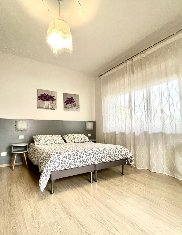 Postel nebo postele na pokoji v ubytování Bella Vita Guesthouse -parcheggio privato interno