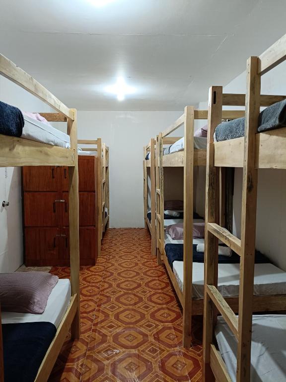 Postel nebo postele na pokoji v ubytování Aloha Hostel Siargao