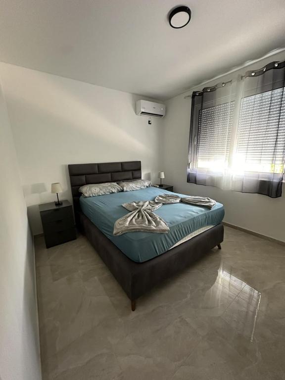 Postel nebo postele na pokoji v ubytování Bungalow Cleo