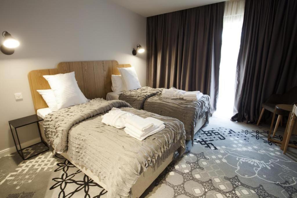 Postel nebo postele na pokoji v ubytování Rasta Maidan Hotel
