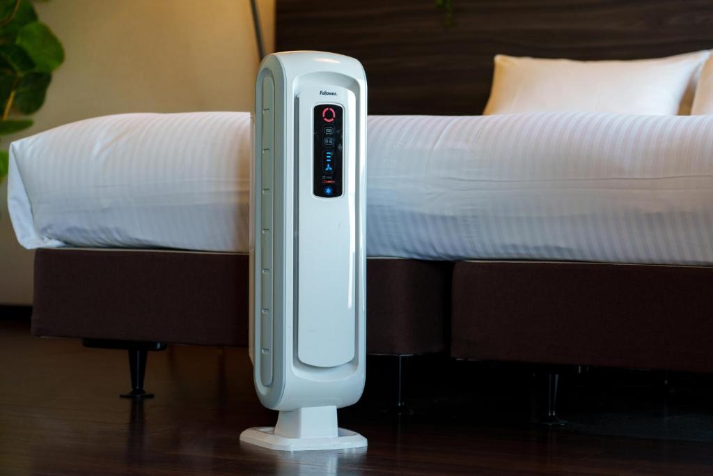 Postel nebo postele na pokoji v ubytování Nipponbashi Luxe Hotel