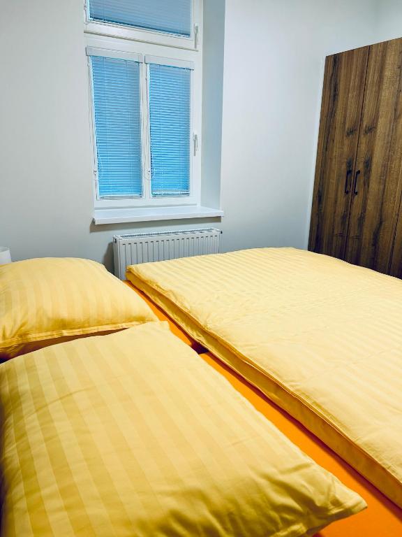 Postel nebo postele na pokoji v ubytování Vila Silva Karlova Studánka