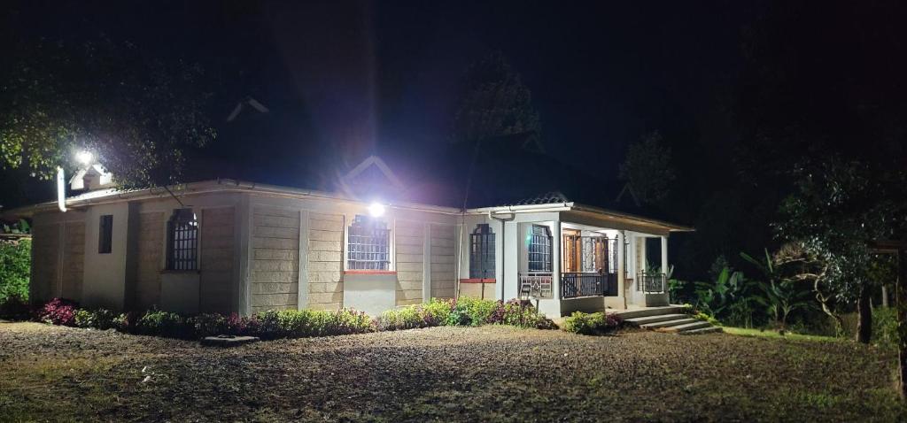a small house with a light on top of it at Aberdare Home in Othaya