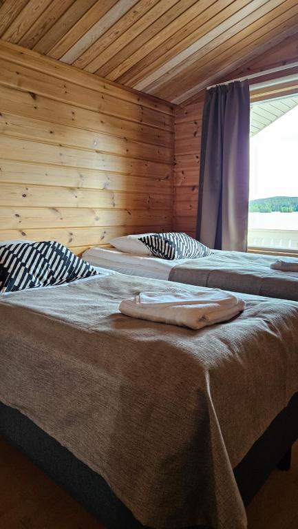 Postel nebo postele na pokoji v ubytování Jauri Resort