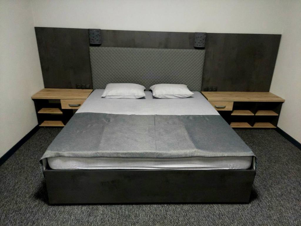 Postel nebo postele na pokoji v ubytování Alfa
