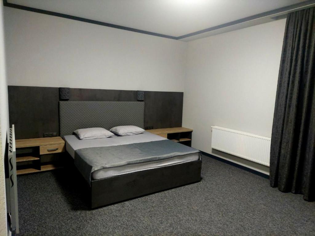 Postel nebo postele na pokoji v ubytování Alfa