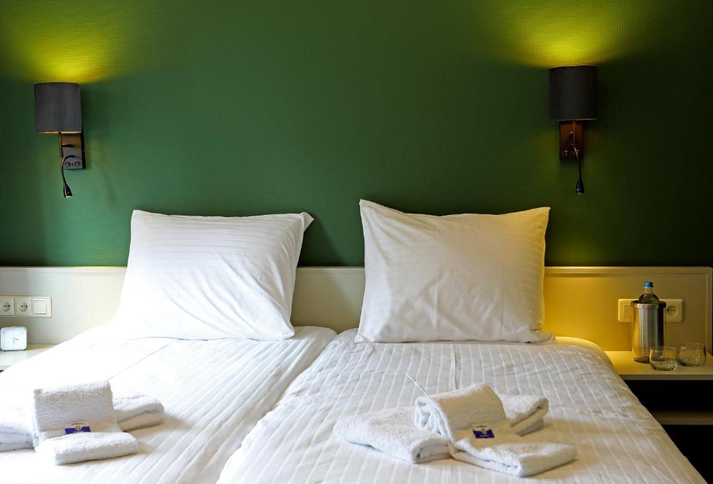 Postel nebo postele na pokoji v ubytování Hotel Bi-j Ons