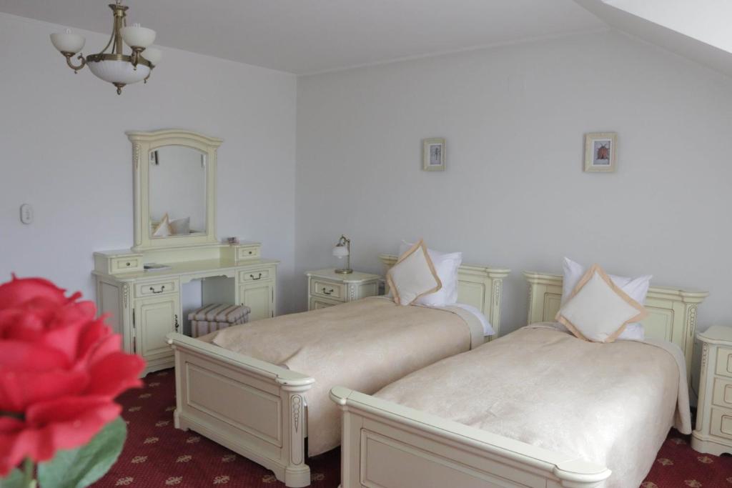 Postel nebo postele na pokoji v ubytování Hotel Slavia