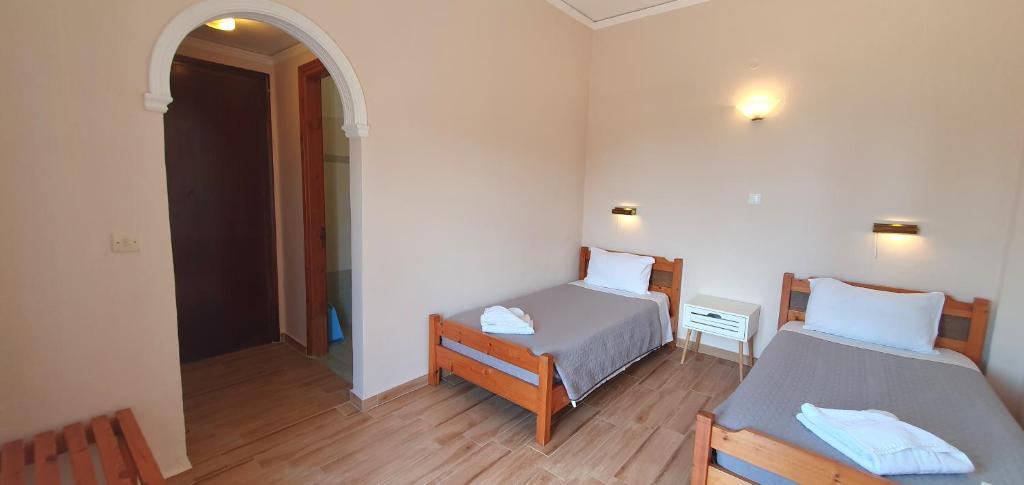 Postel nebo postele na pokoji v ubytování Paleo Inn Hotel