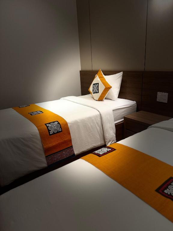 Giường trong phòng chung tại Ha Giang Hostel