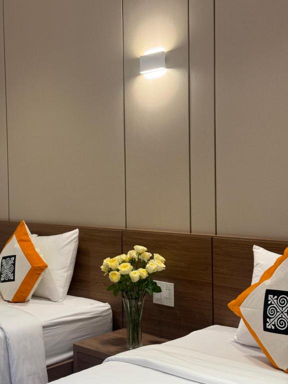 Giường trong phòng chung tại Ha Giang Hostel