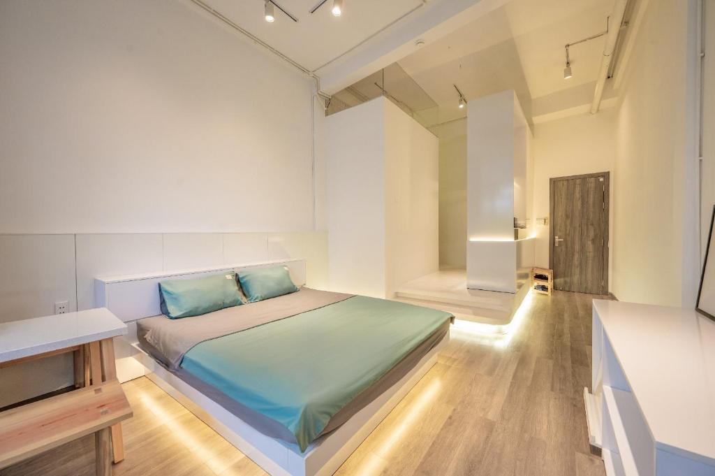 Postel nebo postele na pokoji v ubytování Q Hotel & Apartment Da Nang