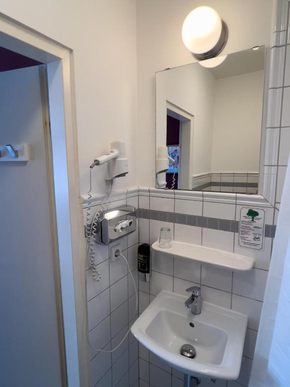 Koupelna v ubytování Hotel-Maison Am Olivaer Platz
