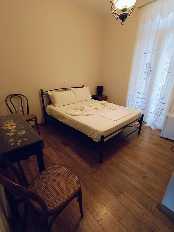 Postel nebo postele na pokoji v ubytování Anesis Hotel