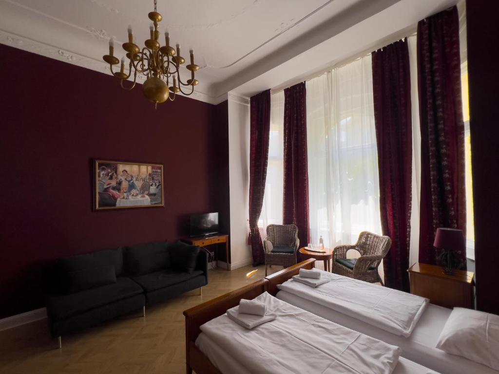 Postel nebo postele na pokoji v ubytování Hotel-Maison Am Olivaer Platz